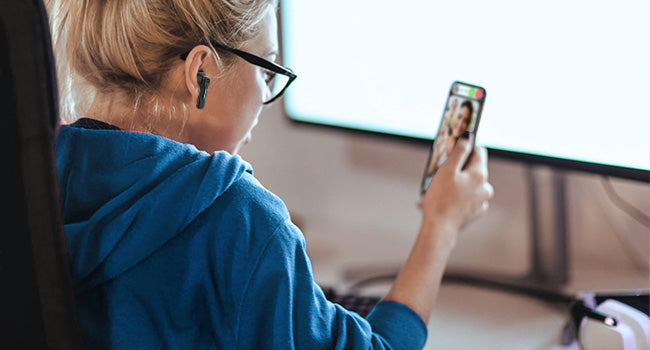 Taking a phone call while working at a computer